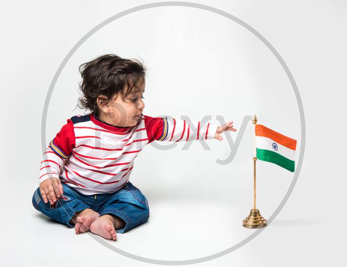 cute little Indian baby boy with indian flag