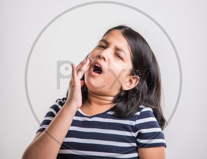 Cute little girl having ear ache / pain