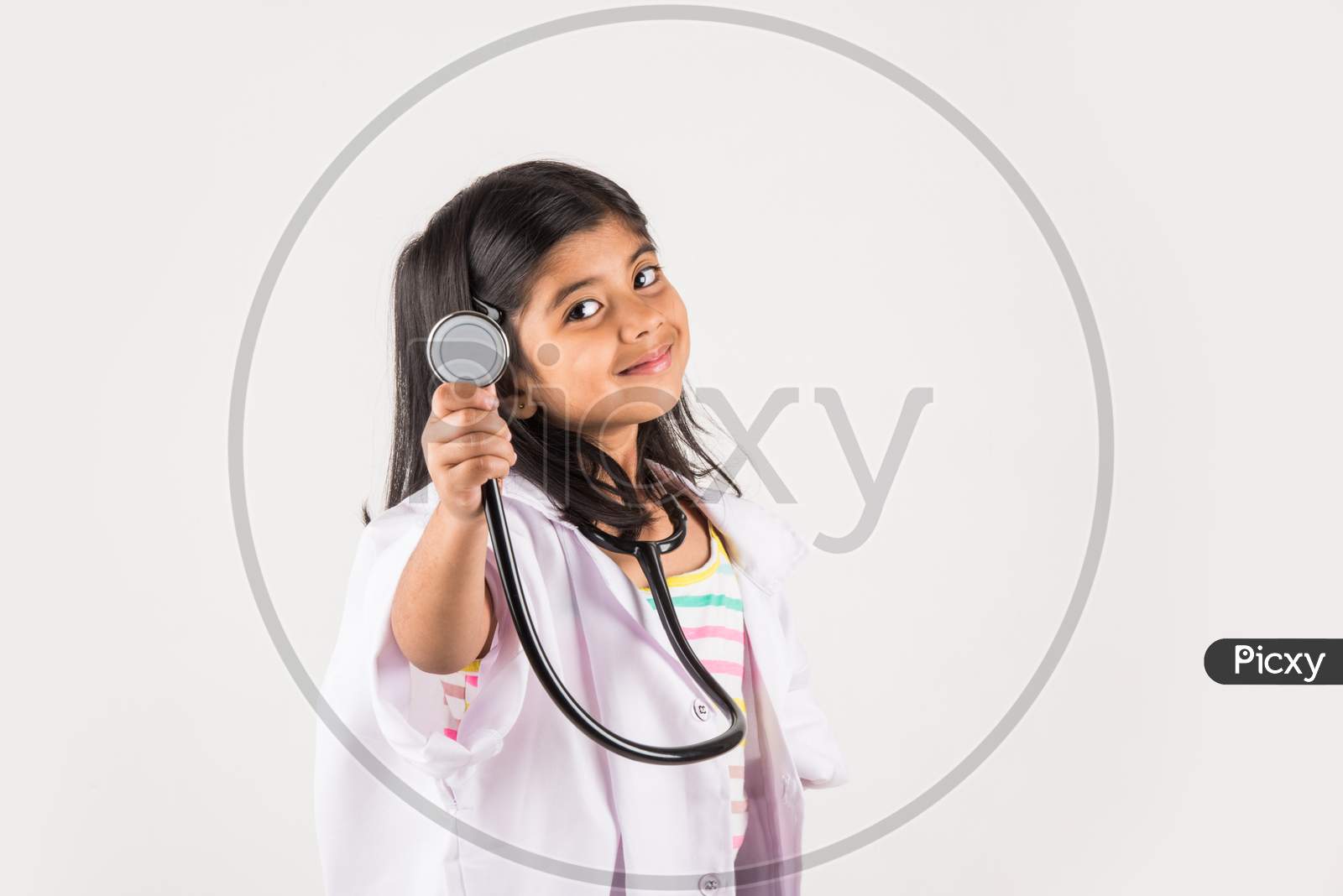 Small girl in doctor cloth with stethoscope