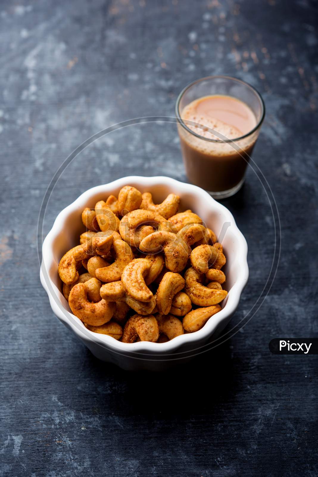 Image of Masala Kaju or spicy Cashew in a bowl-TQ942529-Picxy