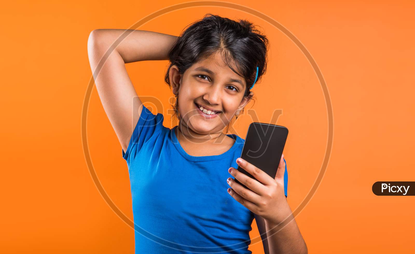 Small Girl using smartphone for playing game or taking selfie picture