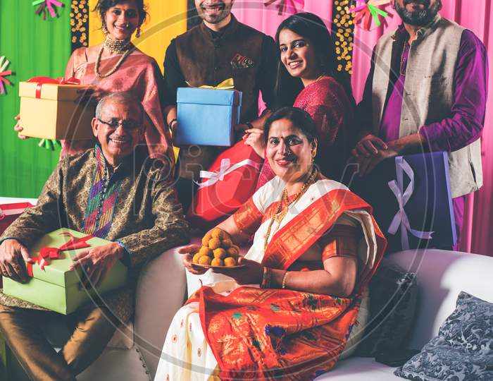 Group photo of indian family while celebrating festival