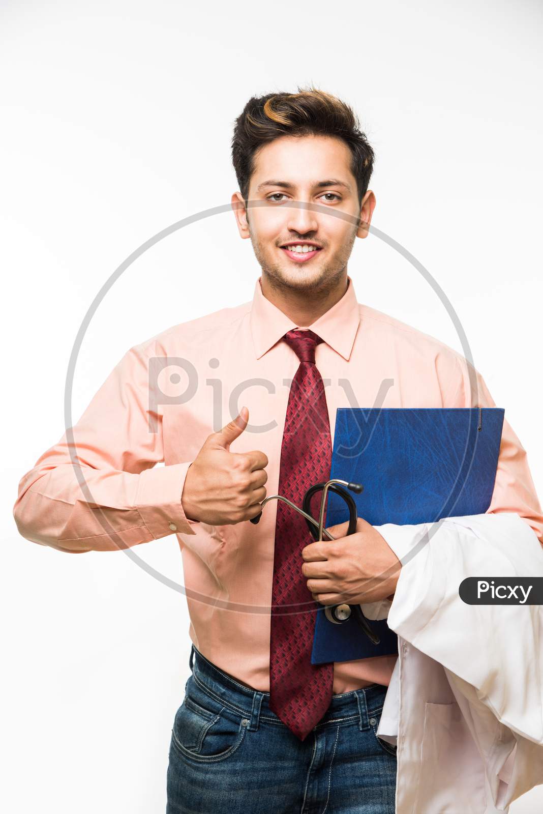 Young male doctor / nurse with stethoscope, standing isolated over white background