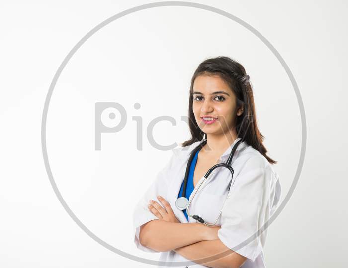 Indian/asian Female Doctor with stethoscope, standing isolated over white background over white background