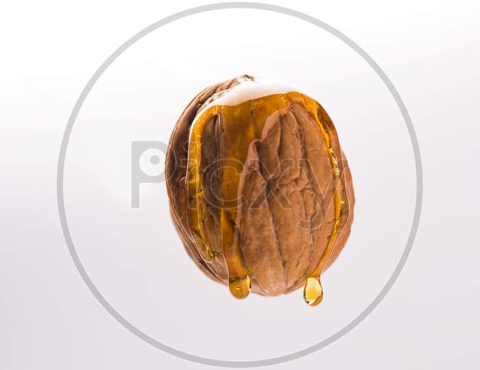 Golden walnut oil drop