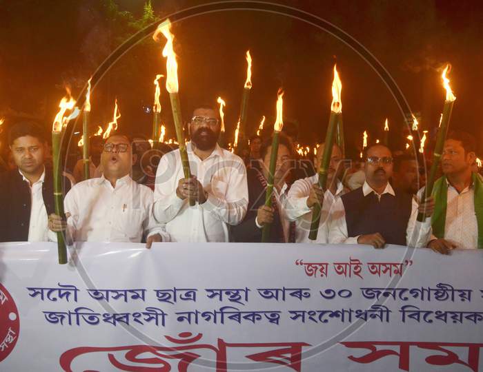 Activists of All Assam Students Union (AASU) taking out a Torch Light procession