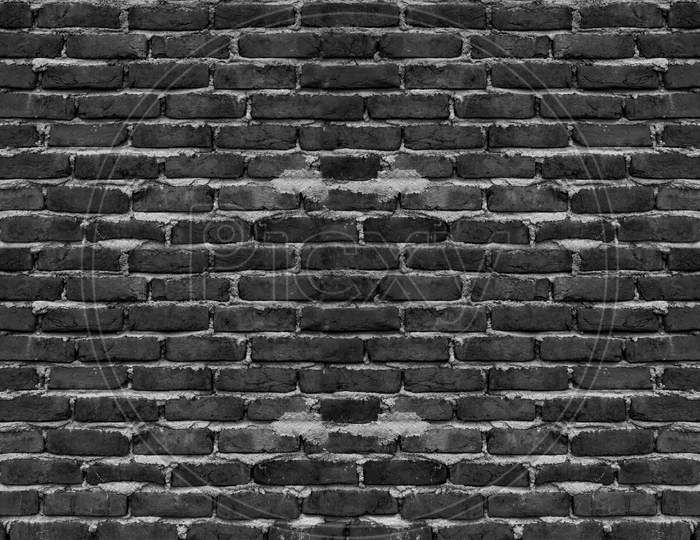 Dark Brick Wall Uneven Texture. Grunge Vintage Background
