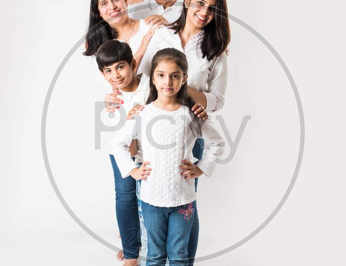 Indian family standing isolated over white background