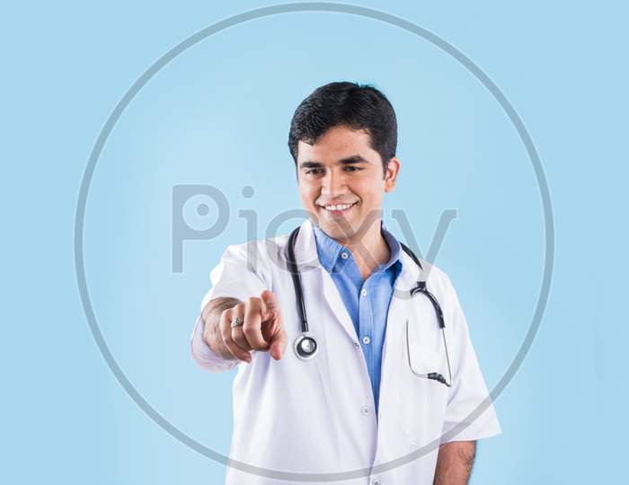 Indian male doctor touching virtual screen