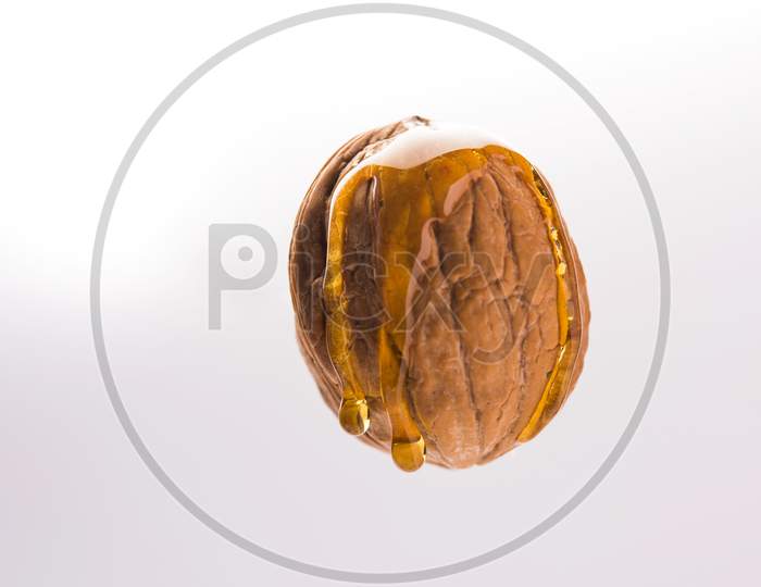 Golden walnut oil drop