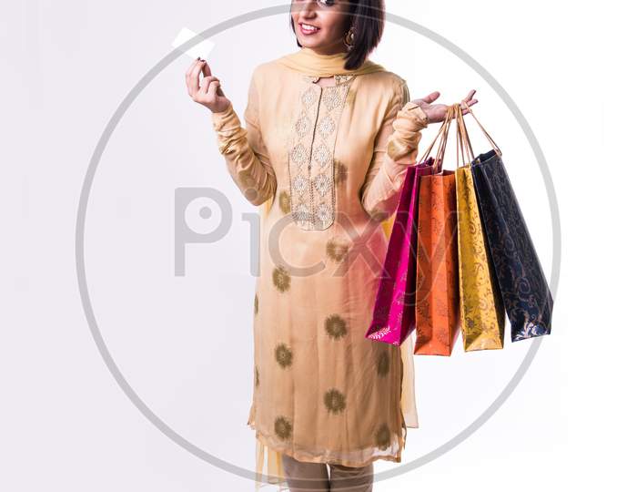 Girl with shopping bags and debit / credit card