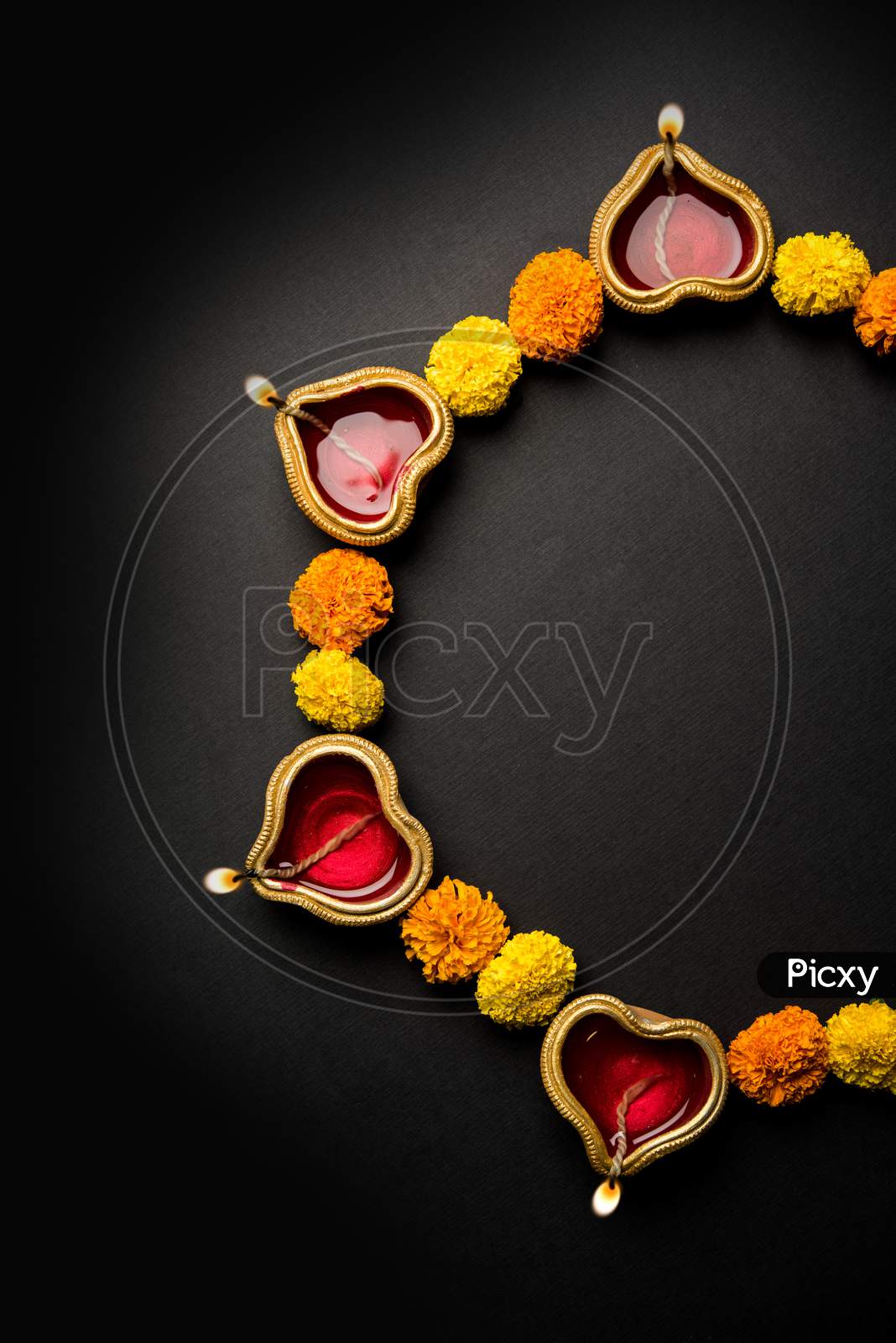Diya and flower rangoli for Diwali festival