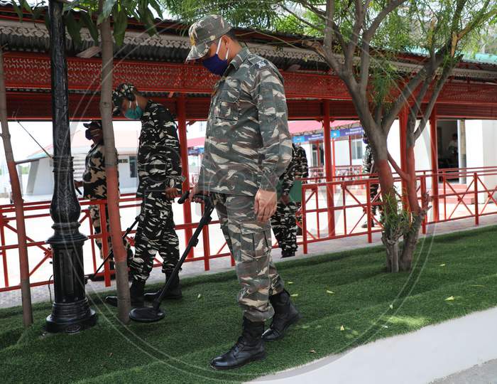 Security personnel check the perimeter at the base camp of Amarnath Yatra with metal detectors in Jammu  on July 11, 2020