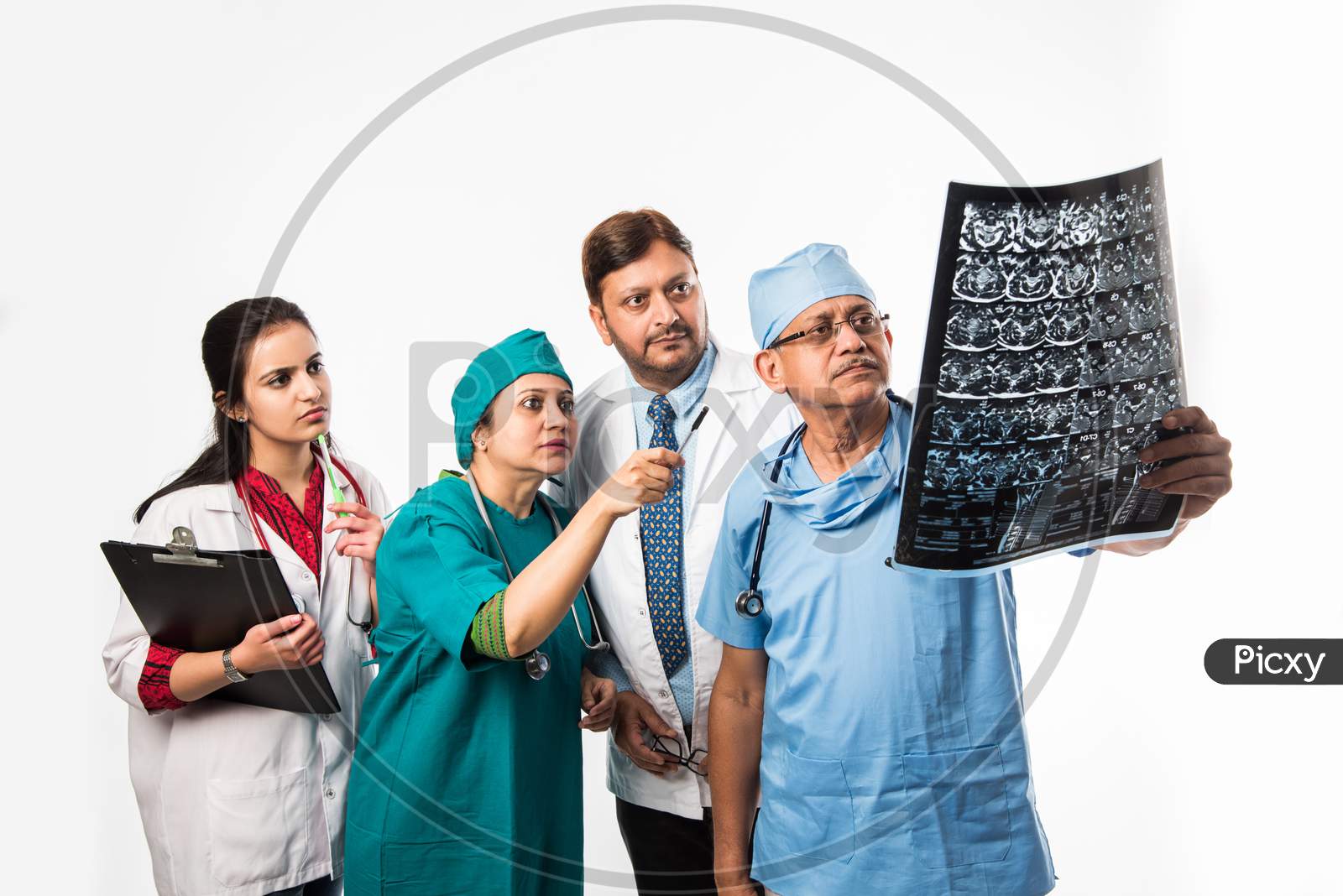 Indian/asian doctors looking an x-ray/MRI , isolated over white background. selective focus
