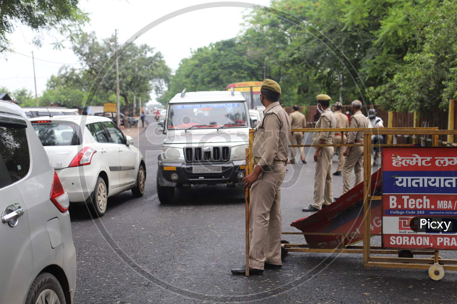 Police officials inspect vehicles during the lockdown in Prayagraj, Uttar Pradesh on July 12, 2020