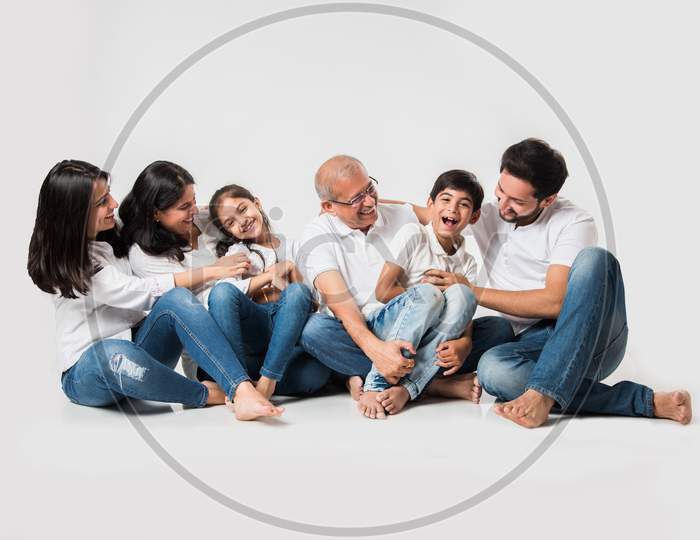 family of 6 sitting over white background
