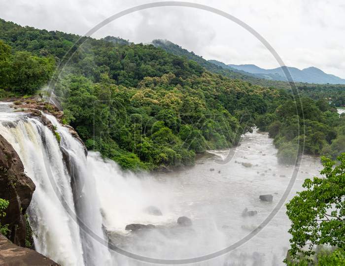 Beautiful Nature View During Monsoon Time With Full Filled Water Fall And Green Forest From The Famous Tourist Place In Kerala, India Called Athirappalli, Vaazhachaal