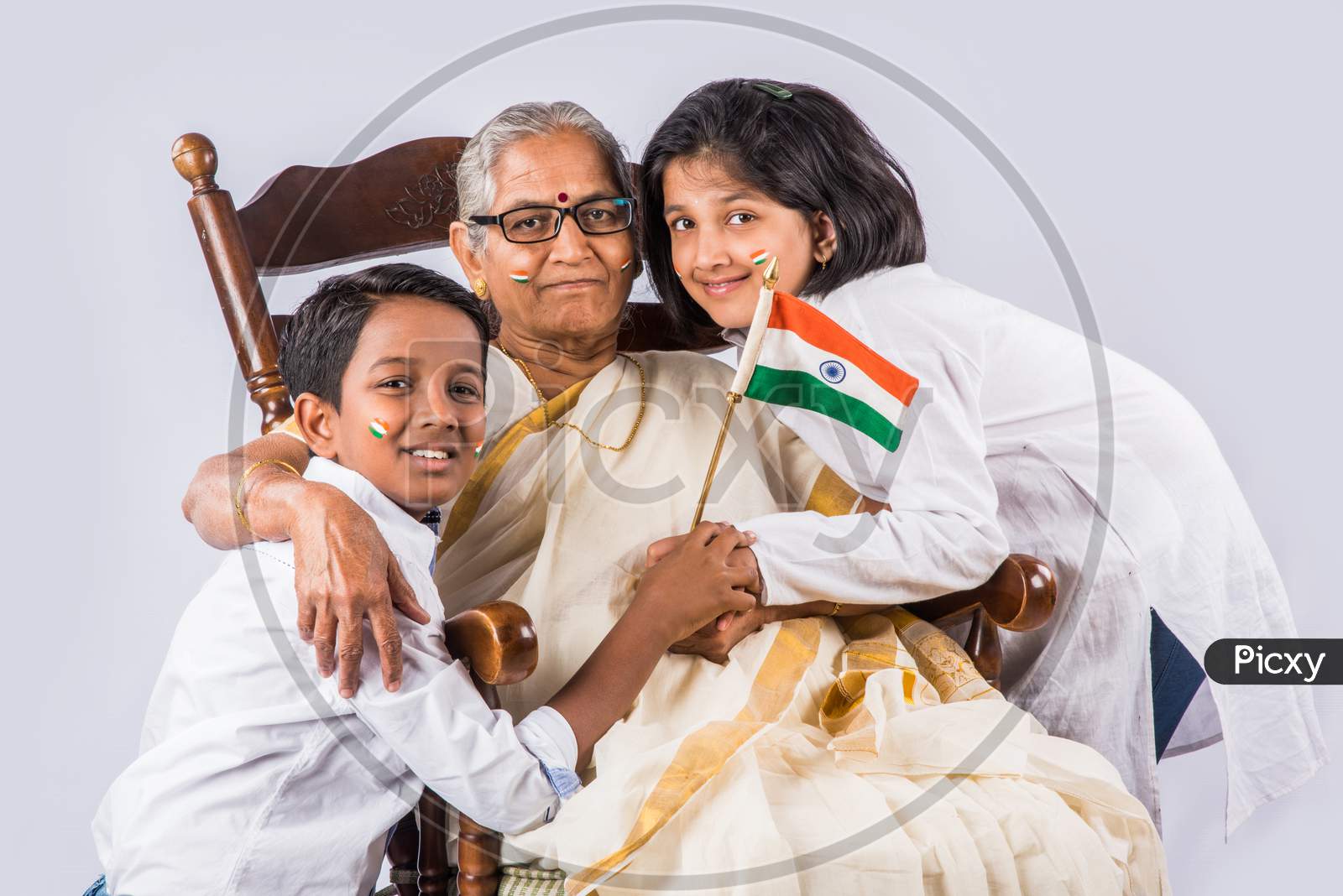 Indian family holding national flag on Independence day or Republic day
