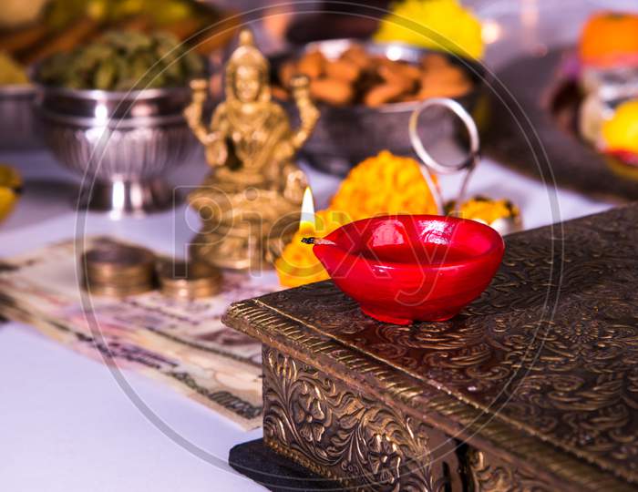 Goddess Laxmi Puja on Diwali with Sweets and Diya