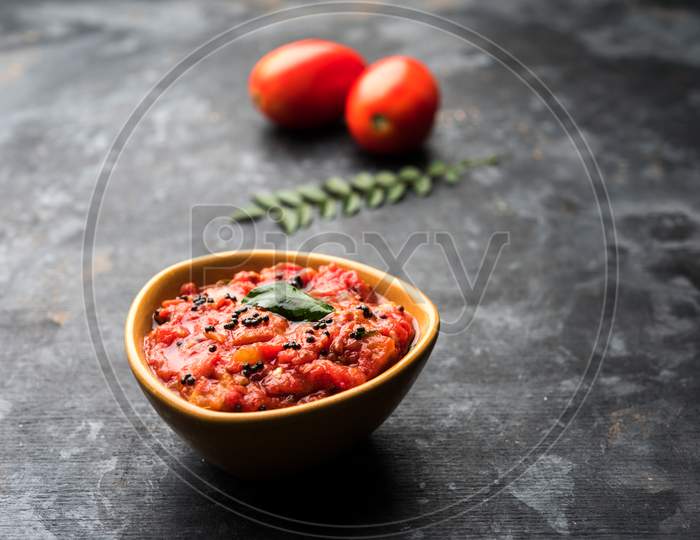 Tomato/tamatar chutney or sauce, served in a bowl. selective focus