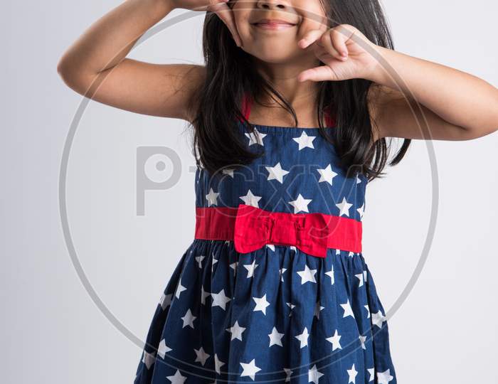 Portrait of Indian small girl over white background