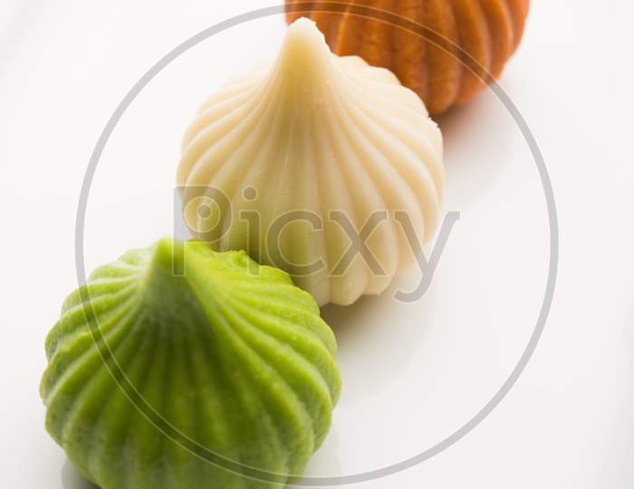 Sweet Tiranga modak shape mithai or dumpling for Independence or republic day greeting card