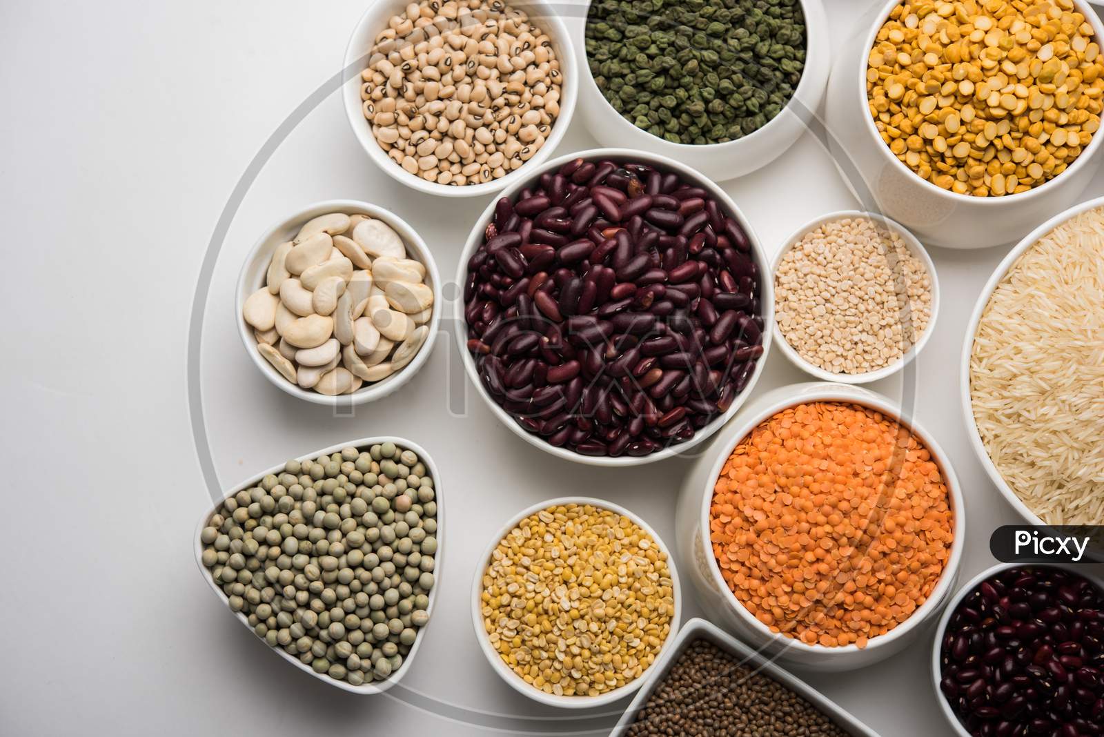 Uncooked pulses,grains and seeds in White bowls
