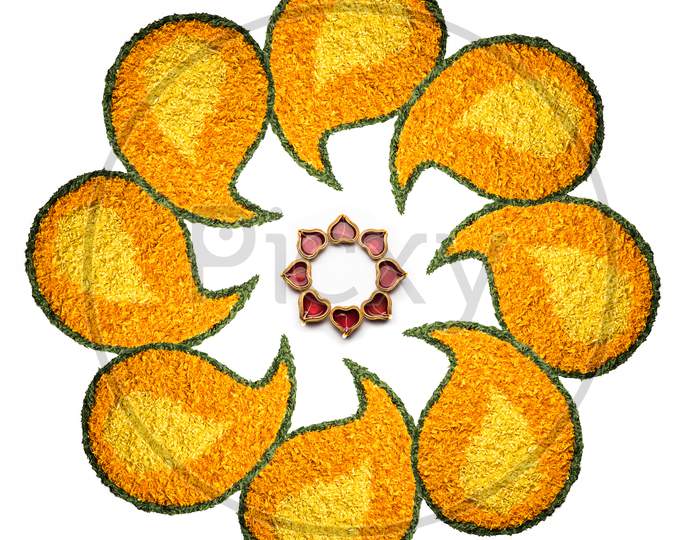 Diwali Flower Rangoli with diya over white background