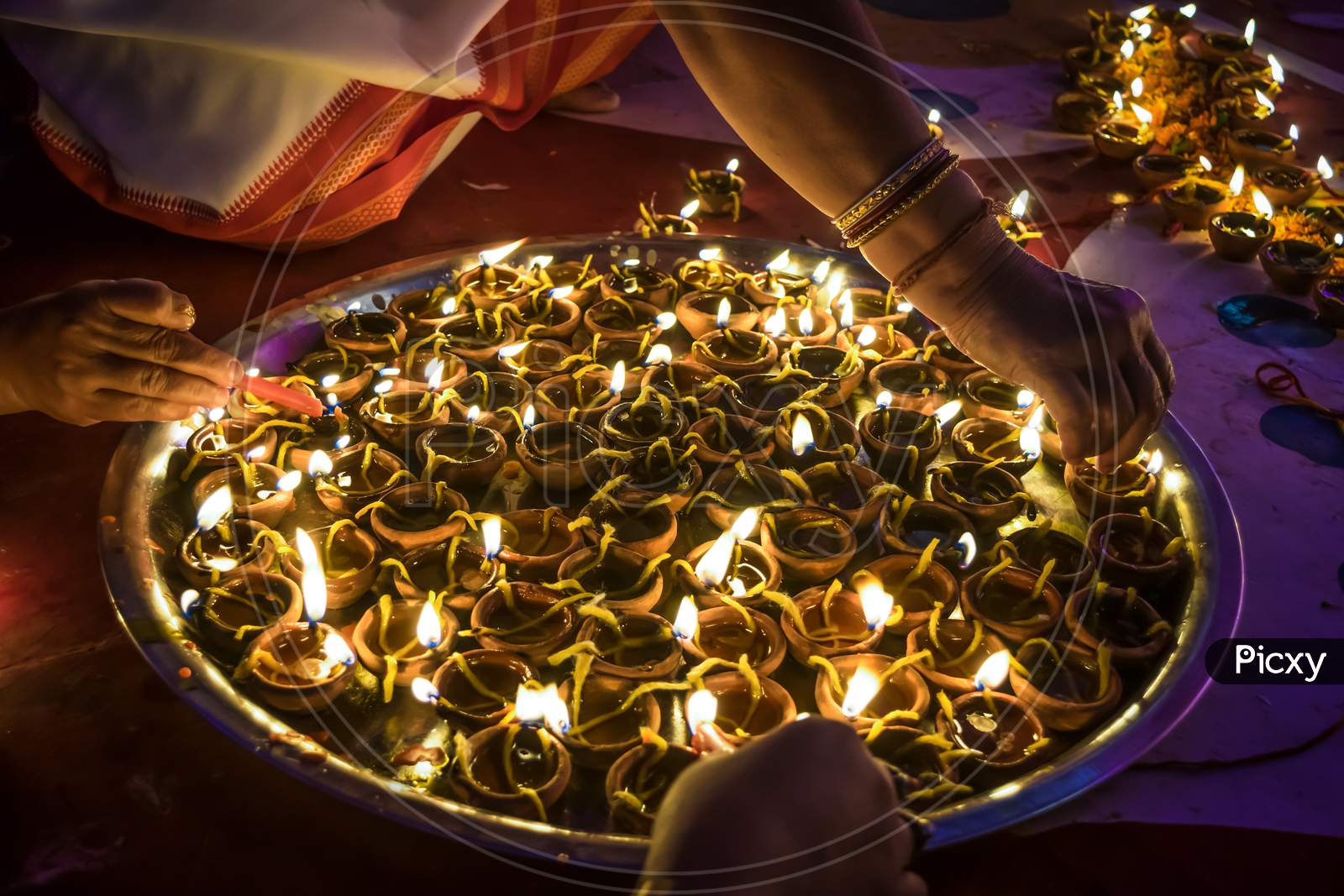 The Dish Is Filled With Diya Or Lamps Being Arranged For Worship