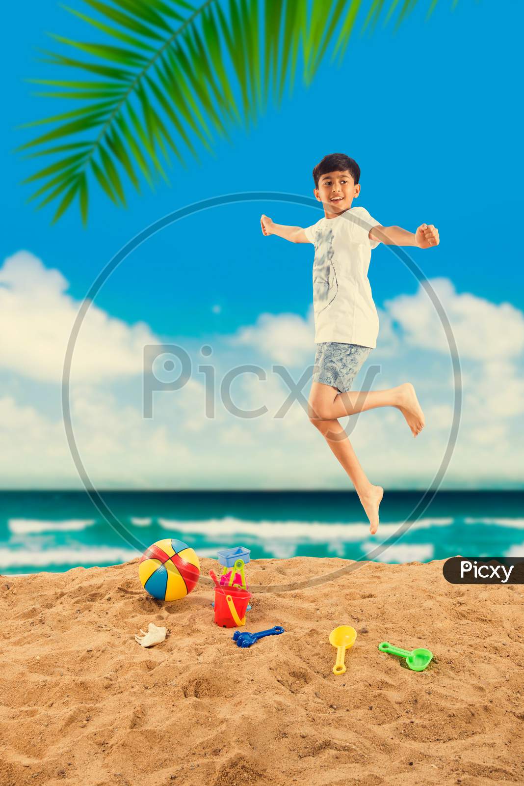 Kid with grand parents playing at beach