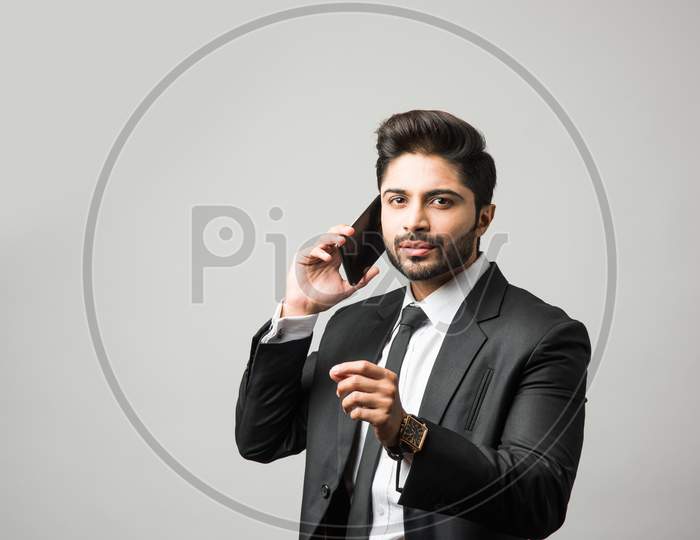 Indian business man using cell phone