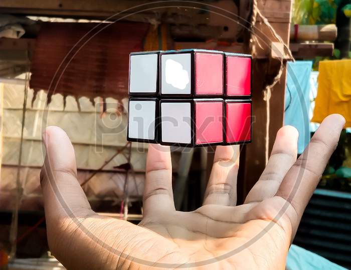 man hand catching a cube