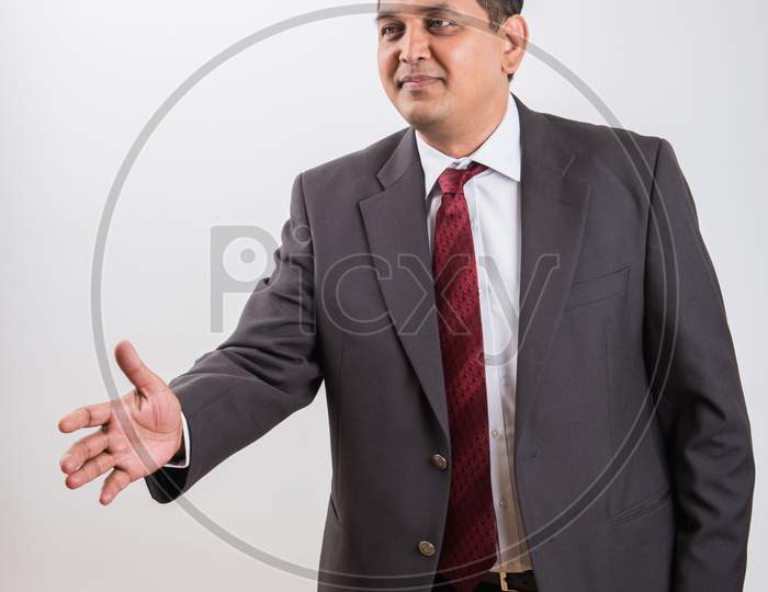 Indian handsome Businessman doing handshake
