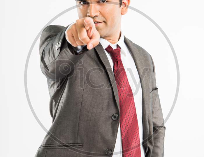Indian young businessman pointing