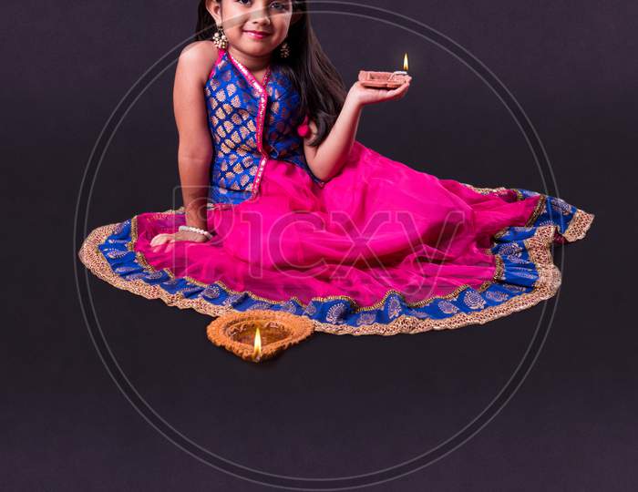 Girl Holding Diwali Diya