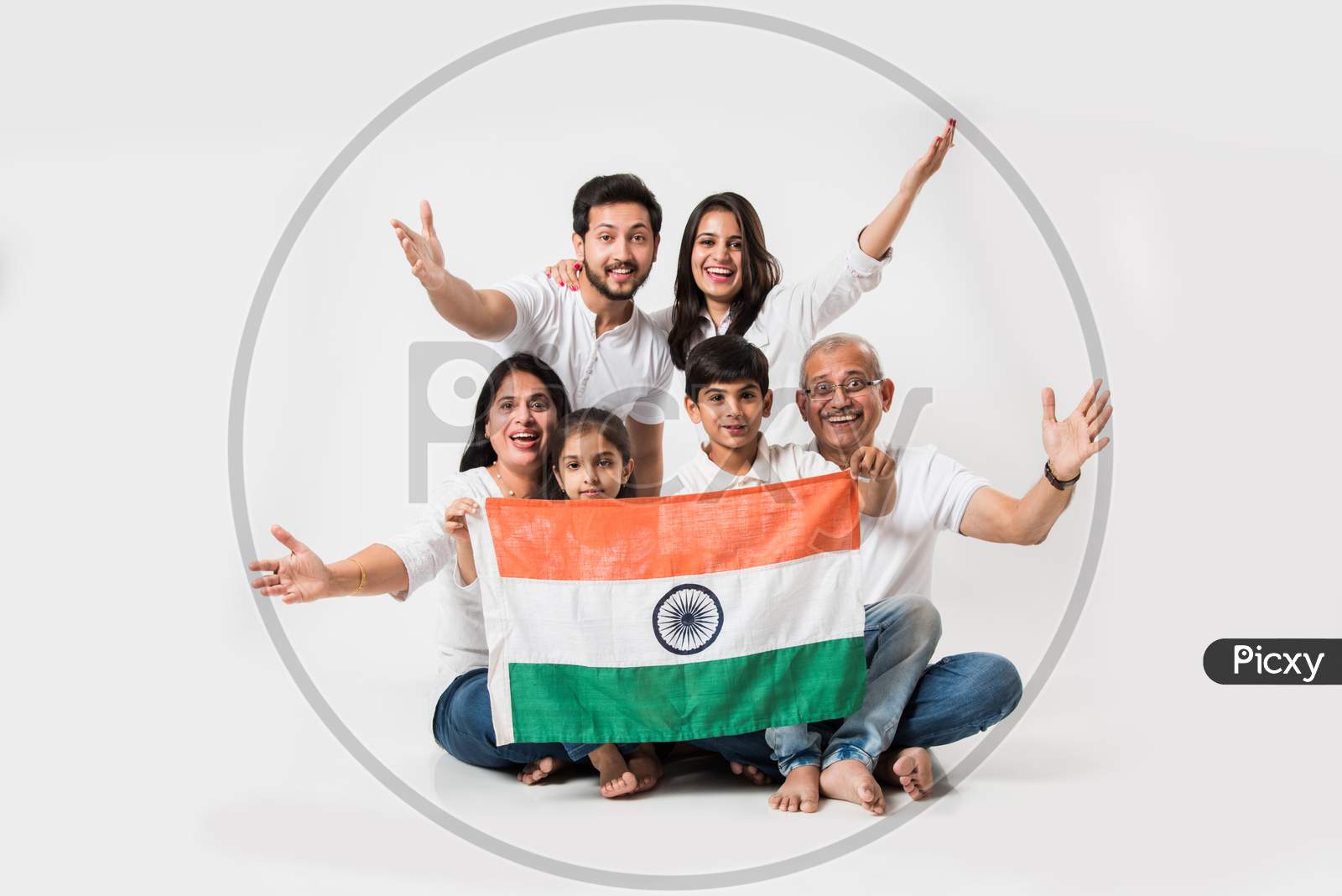 Happy Indian family holding national tricolour flag