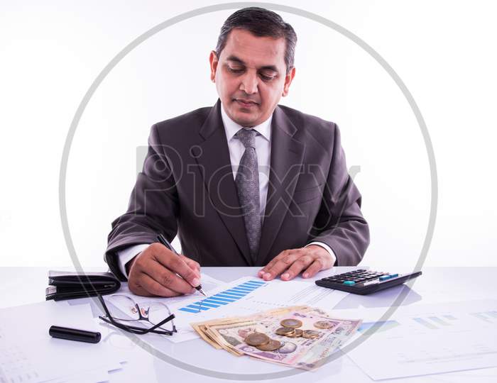 India and accounting concept showing accountant working on Income tax forms with currency notes, calculator and house/car 3d Mod