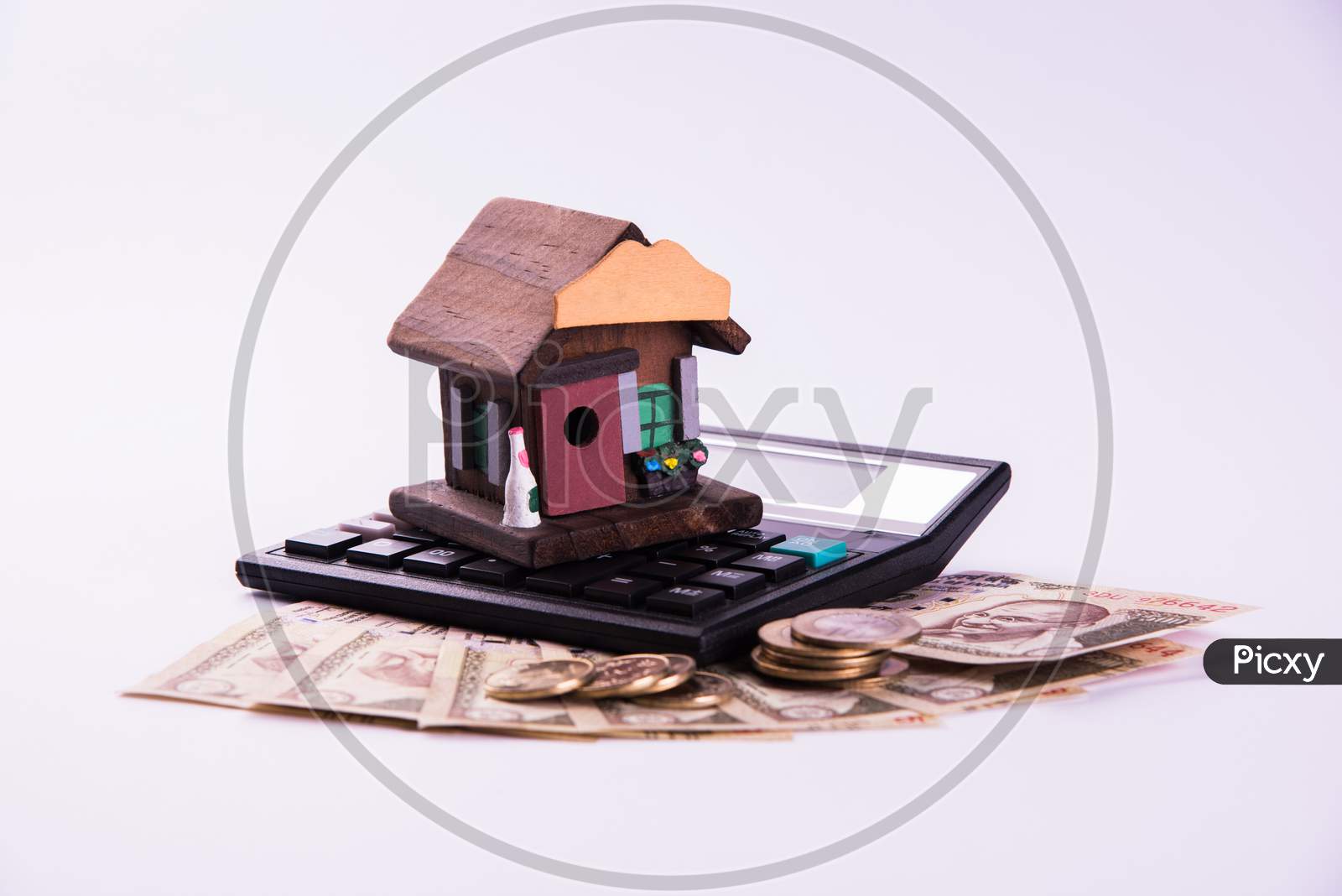 Indian Real Estate Finance and Housing Loan or buying concept showing Rupees, 3D house model, calculator etc