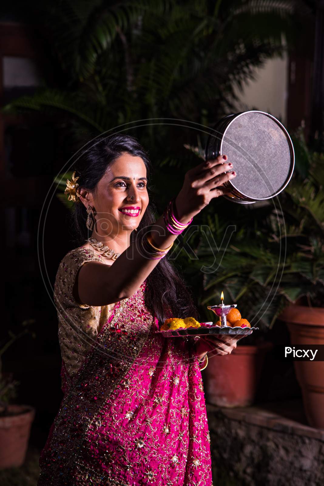 Young wife celebrating karwa chauth festival