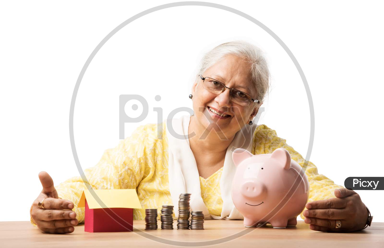Senior woman with money or coins and piggy bank- saving concept