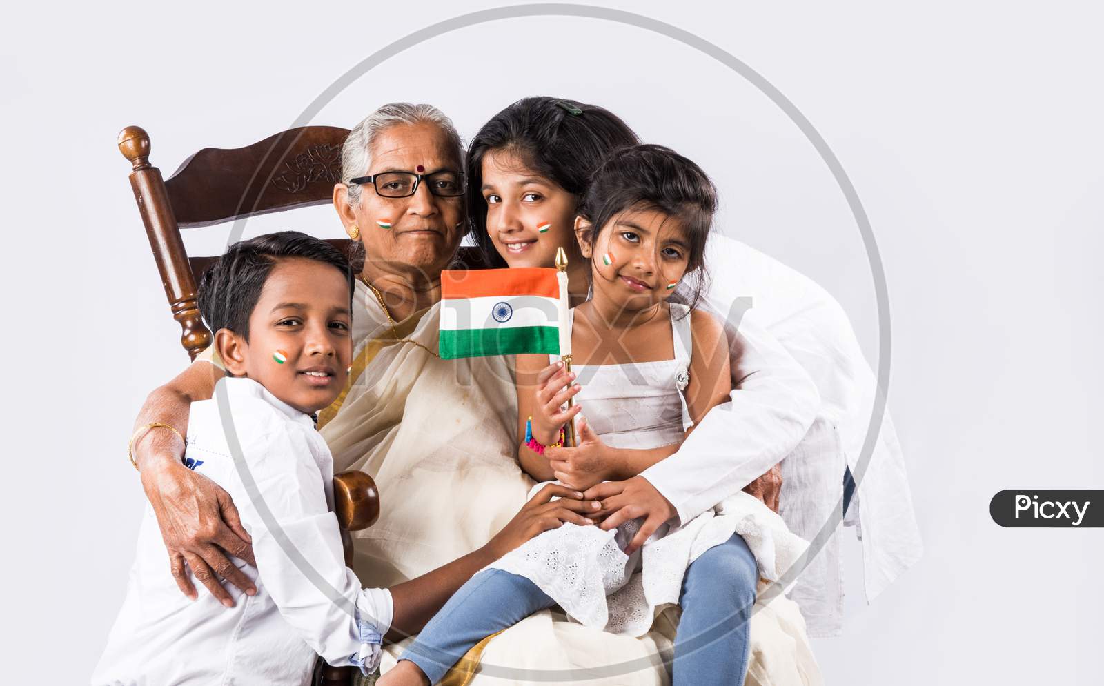 Indian family holding national flag on Independence day or Republic day