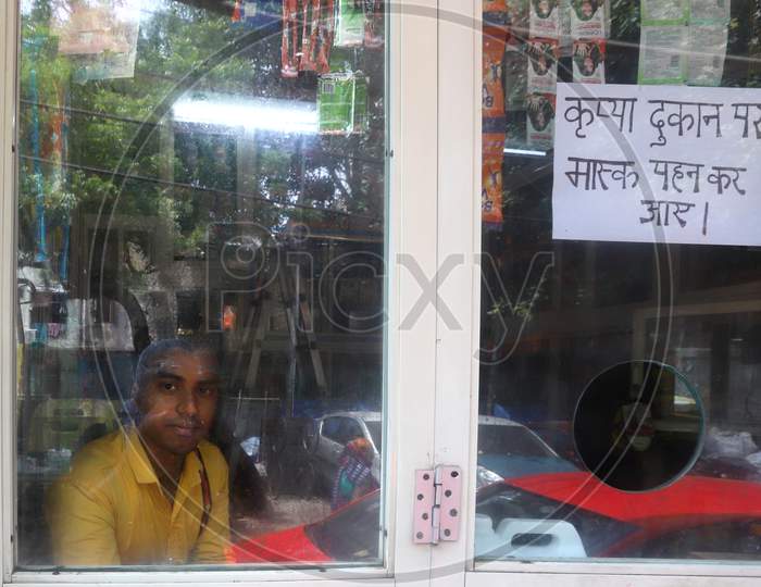 A shopkeeper waits for customers in the market of Paharganj in New Delhi on July 06, 2020