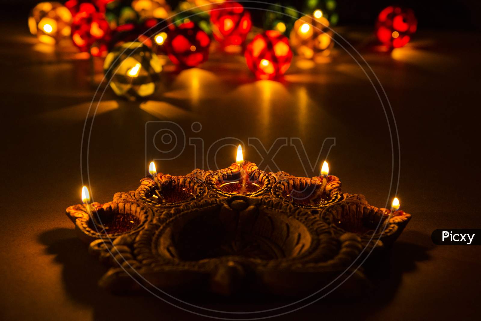 Diwali diyas at night with bokeh of lighting series