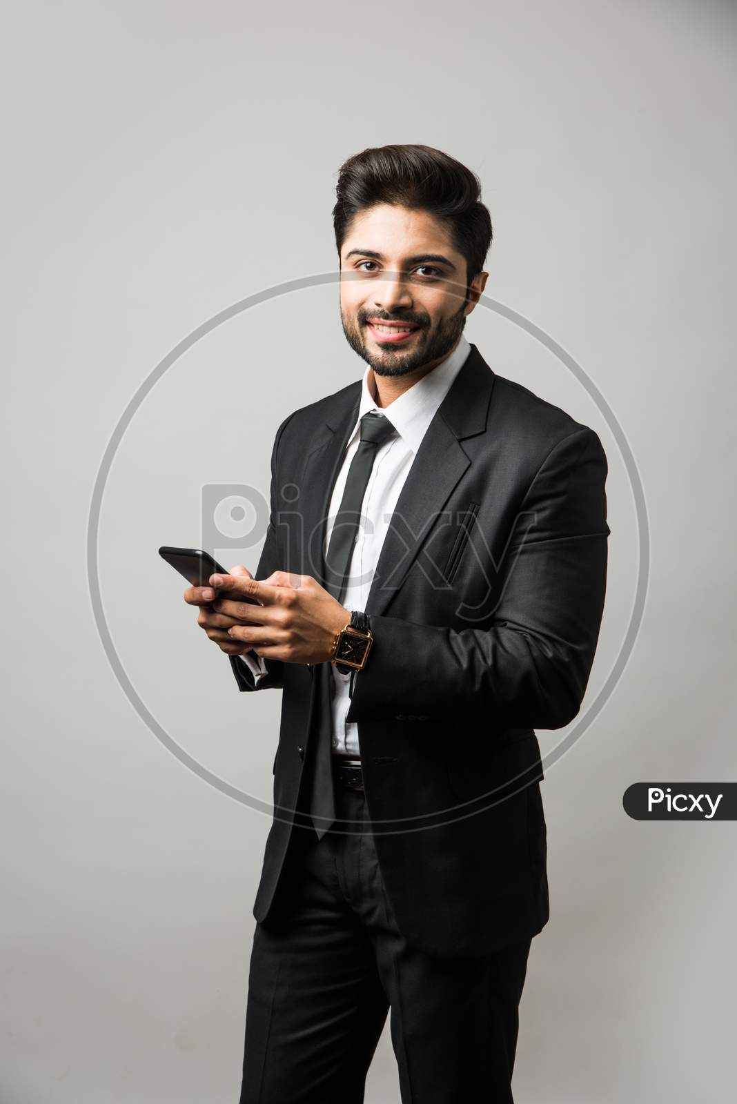 Indian business man using cell phone
