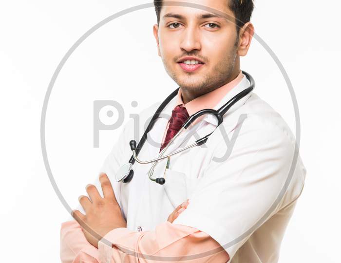 Young male doctor / nurse with stethoscope, standing isolated over white background