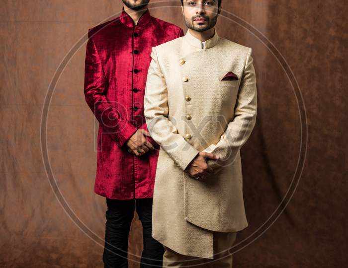 Two male models wearing sherwani / jodhpuri or kurta pyjama
