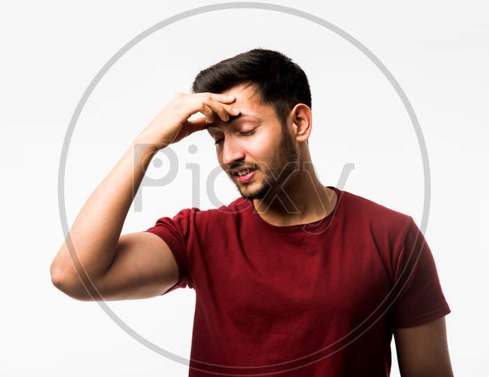 man suffering from head ache