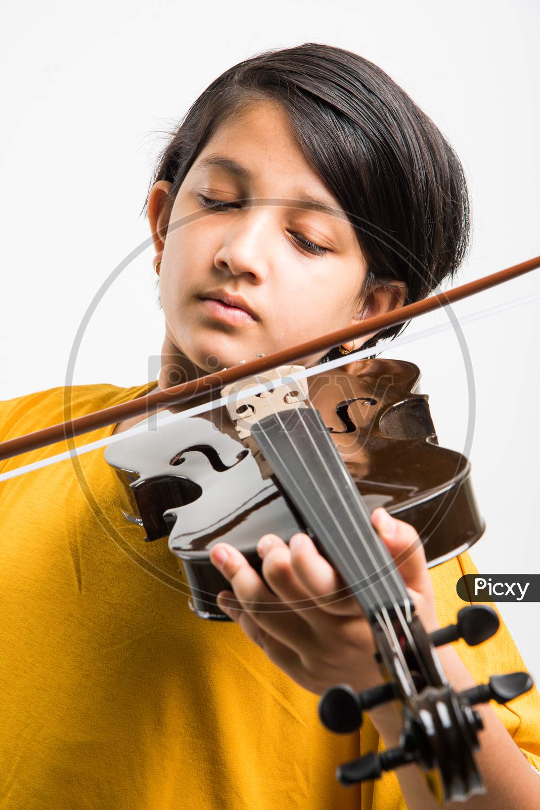 Small Girl playing violin over white background