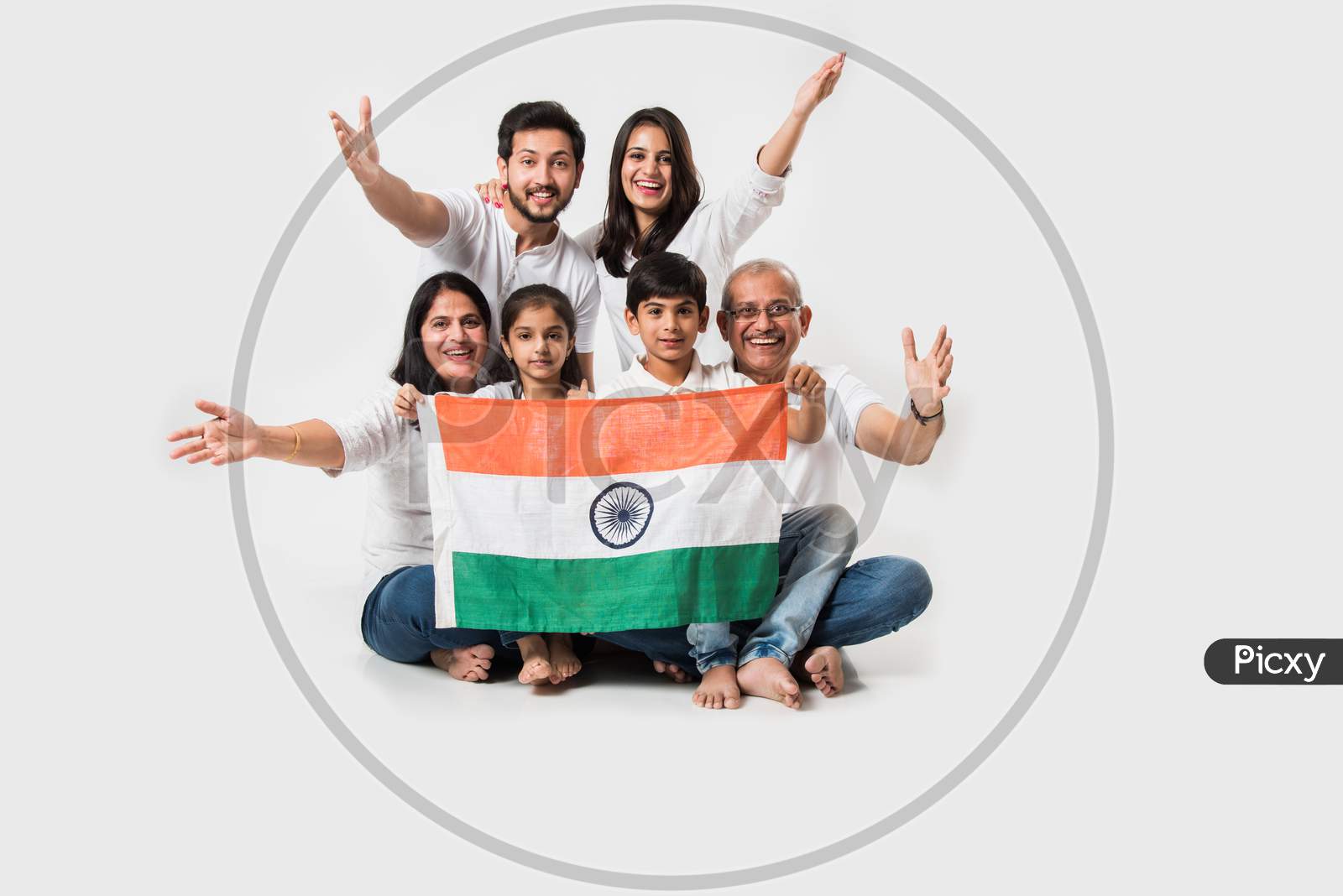Happy Indian family holding national tricolour flag
