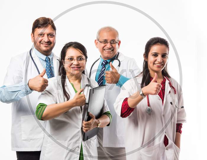 group of Indian doctors showing success sign or thumbs up